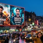 digital billboard in Mumbai showing Ranveer Singh in a rugged action pose and Akshay Kumar in a funny horror expression.