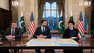 Vice President JD Vance shaking hands with a Pakistani official on a red carpet at an airport.