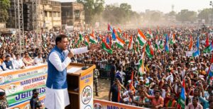 An Indian political leader addressing a massive, energetic election rally in West Bengal, surrounded by supporters holding colorful flags under the bright sun.