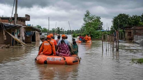 Disaster response teams navigating flooded rural roads in Patna during a Bihar flood alert