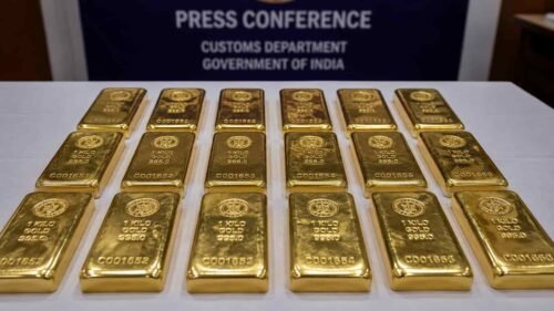 Foreign-origin gold bars seized by DRI officers displayed on a table after a raid at Nagpur Railway Station