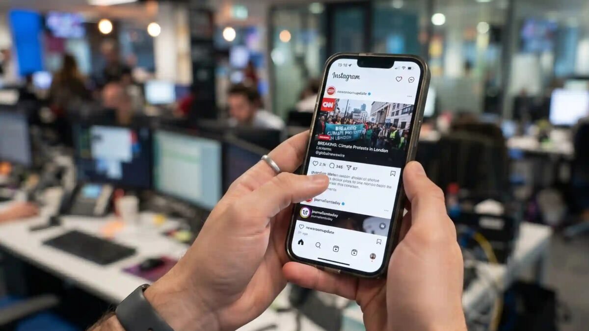 Smartphone screen displaying social media posts regarding virus origins